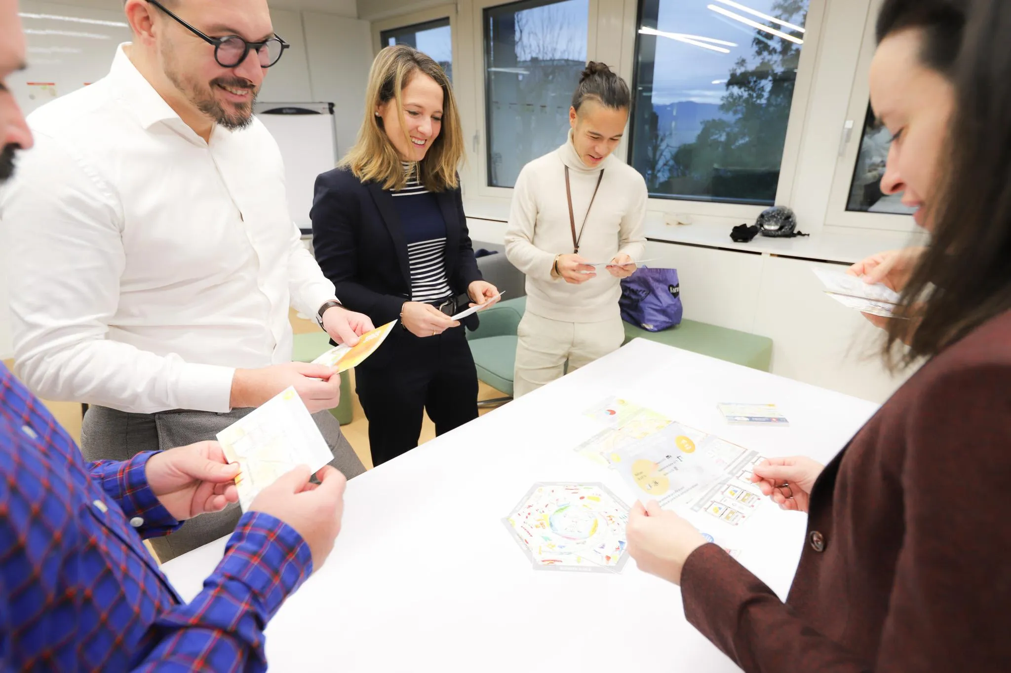 Atelier de la Fresque de la construction avec des collaborateurs et clients Romande Energie